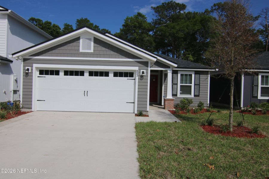 Front exterior of a new home in , Jacksonville, FL, highlighting curb appeal (Image 15).