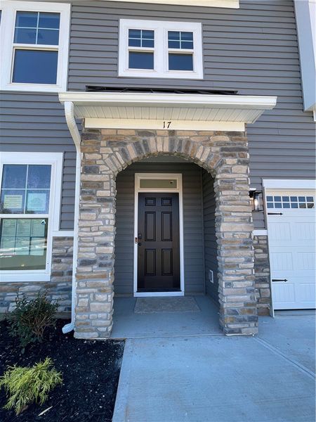 Exterior details and patio area of a home in Springwood Grove, Central (Image 13).