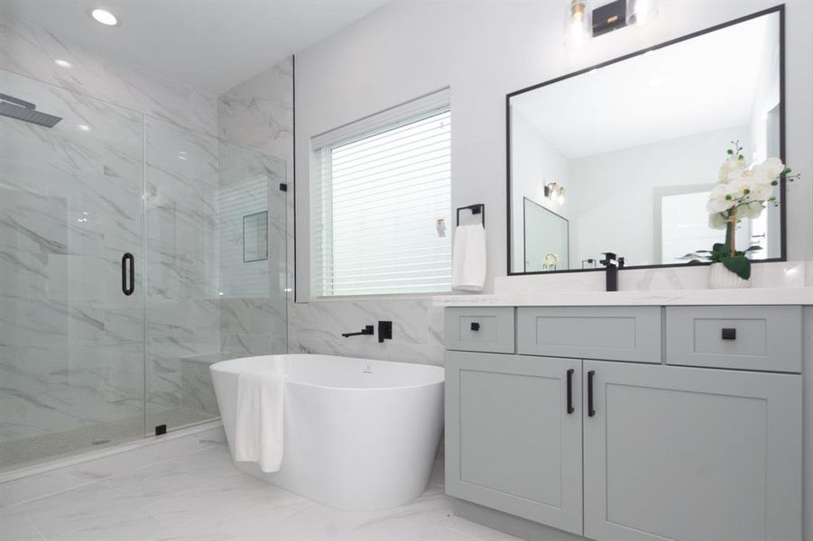 Porcelain tile flooring and walls in the shower area are not only stylish but also durable and easy to maintain.