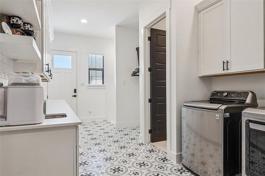 Very large laundry room with a dog shower right by the outside door.