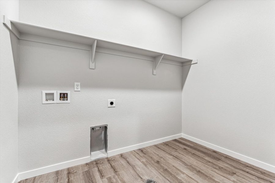 A white wall with a metal bar.