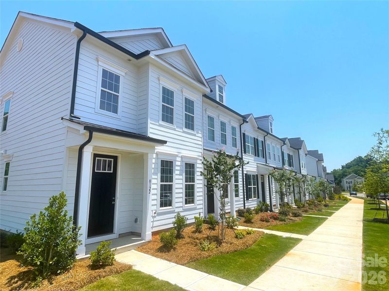 Front exterior of a new home in Edgewood Preserve, Huntersville, NC, highlighting curb appeal (Image 24).