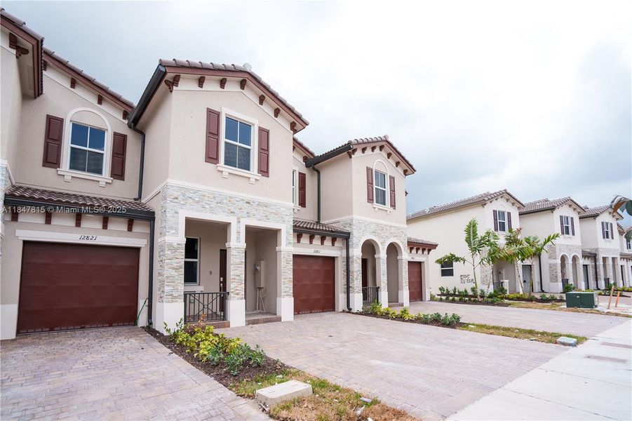 Front exterior of a new home in , Miami, FL, highlighting curb appeal (Image 1). Front exterior of a new home in , Miami, FL, highlighting curb appeal (Image 1).