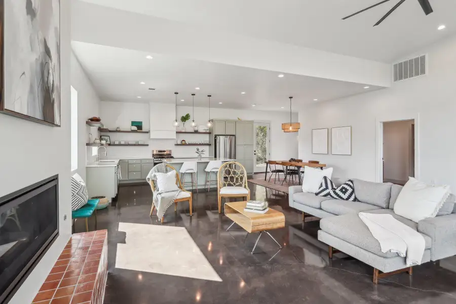 Living area with recessed lighting and ceiling fan Living area with recessed lighting and ceiling fan