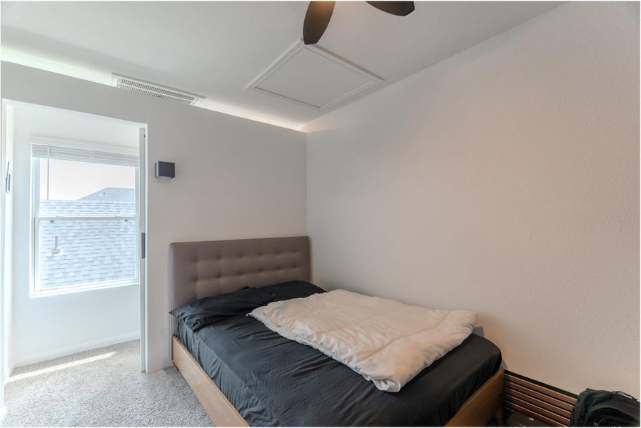 Secondary bedroom upstairs with ample space and barn door. Secondary bedroom upstairs with ample space and barn door.