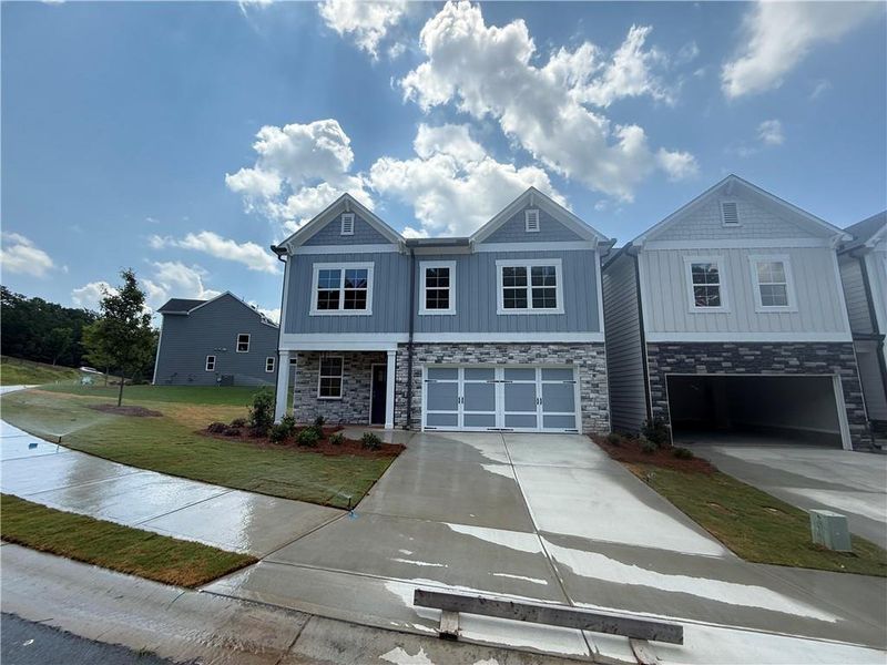 Front exterior of a new home in , Canton, GA, highlighting curb appeal (Image 1). Front exterior of a new home in , Canton, GA, highlighting curb appeal (Image 1).