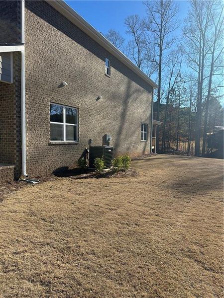 Exterior details and patio area of a home in Mirror Lake at South Harbour, Villa Rica (Image 22).