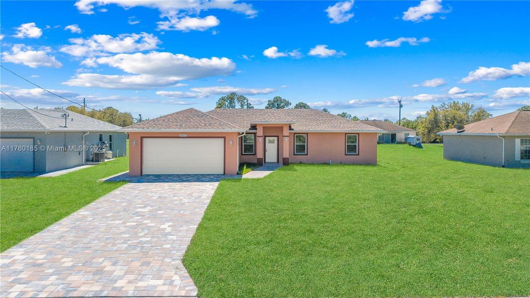 Front exterior of a new home in , Lehigh Acres, FL, highlighting curb appeal (Image 15).