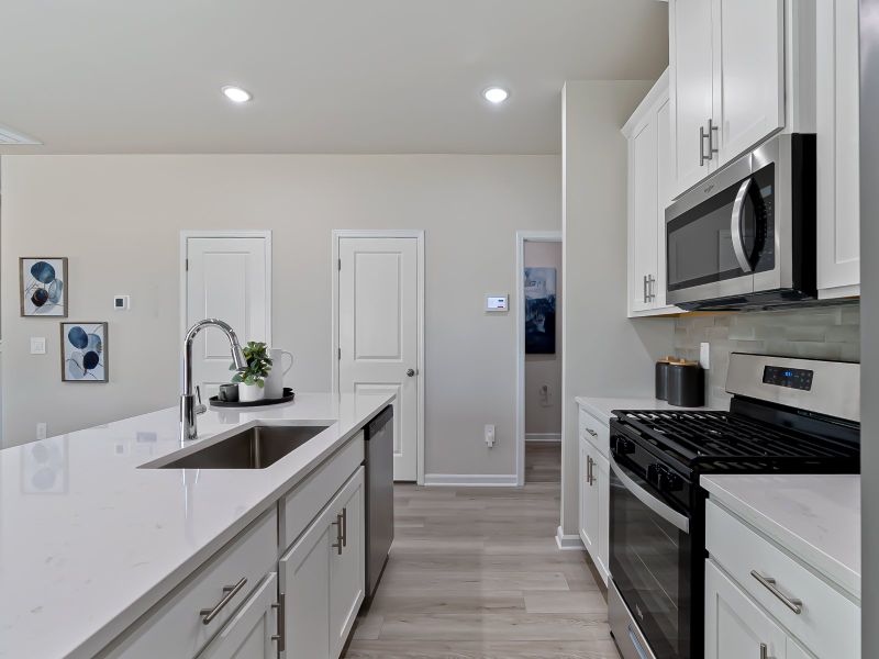 Furnished interior view inside a new home in Cadence Meadows Townes, Zebulon (Image 5). Furnished interior view inside a new home in Cadence Meadows Townes, Zebulon (Image 5).