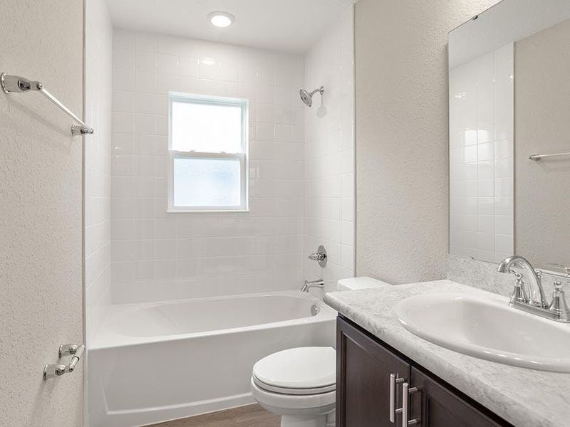 Secondary bedrooms share a convenient hall bath.