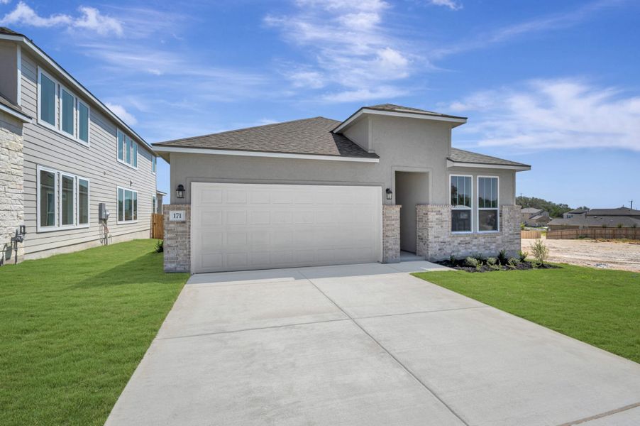 Front exterior of a new home in The Meadows at Hunters Ranch, San Antonio, TX, highlighting curb appeal (Image 23).