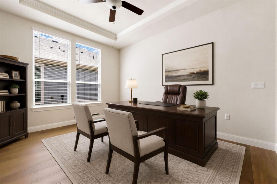 An inviting home office with ample natural light, featuring elegant hardwood flooring and a stylish rug. An inviting home office with ample natural light, featuring elegant hardwood flooring and a stylish rug.