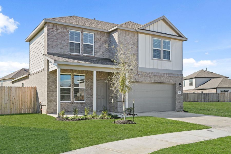 Front exterior of a new home in Riverwood Ranch, Angleton, TX, highlighting curb appeal (Image 15). Front exterior of a new home in Riverwood Ranch, Angleton, TX, highlighting curb appeal (Image 15).