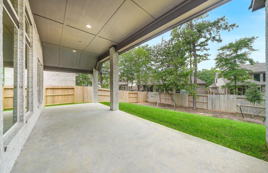 Exterior details and patio area of a home in The Woodlands Hills 65′, Willis (Image 26).