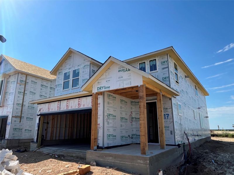 Front exterior of a new home in The Homestead at Lariat, Liberty Hill, TX, highlighting curb appeal (Image 2). Front exterior of a new home in The Homestead at Lariat, Liberty Hill, TX, highlighting curb appeal (Image 2).
