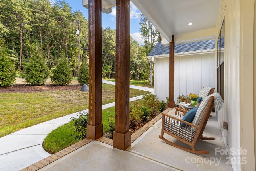 Virtually staged to showcase the front porch's simple and welcoming charm.