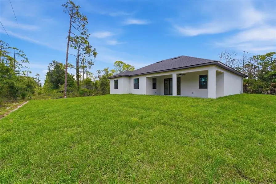 Exterior details and patio area of a home in , Port Charlotte (Image 25).