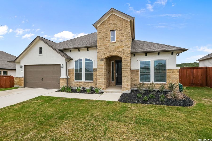 Front exterior of a new home in Homestead, Schertz, TX, highlighting curb appeal (Image 23). Front exterior of a new home in Homestead, Schertz, TX, highlighting curb appeal (Image 23).