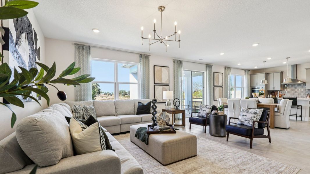 The Mangrove Model Open Concept Living Area at Lakeside at Satilla by DRB Homes in Saint Cloud, FL