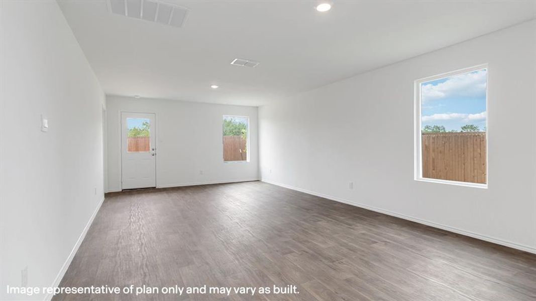 Spare room featuring wood finished floors and recessed lighting
