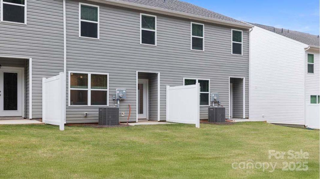 Exterior details and patio area of a home in Clark Creek Landing Townhomes, Lincolnton (Image 4).
