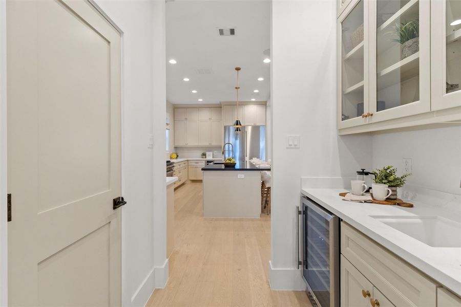 This built-in wet bar adds a polished, entertaining-ready touch right where you want it. With sleek countertops, custom cabinetry, and space for your favorite glassware and beverages, it’s perfect for hosting, unwinding after a long day, or grabbing a quick refreshment without stepping away from the action.