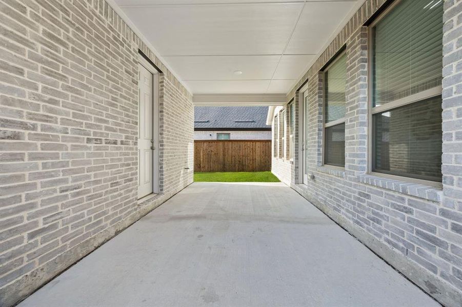 Exterior details and patio area of a home in Cambridge Crossing, Celina (Image 24).