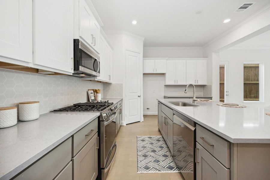 Meet your new culinary partner: a 5-burner LG gas range surrounded by sleek cabinetry, soft-close drawers, and an eye-catching hex backsplash that makes even takeout feel gourmet. Meet your new culinary partner: a 5-burner LG gas range surrounded by sleek cabinetry, soft-close drawers, and an eye-catching hex backsplash that makes even takeout feel gourmet.