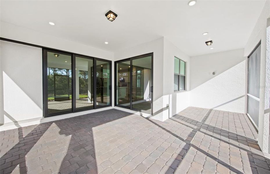 Exterior details and patio area of a home in Cedar Grove at The Woodlands, North Port (Image 20).