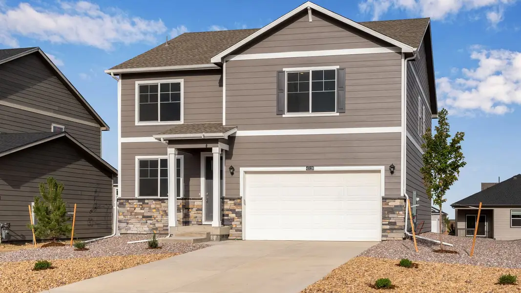 Front exterior of a new home in Fossil Creek Ranch, Windsor, CO, highlighting curb appeal (Image 1). Front exterior of a new home in Fossil Creek Ranch, Windsor, CO, highlighting curb appeal (Image 1).
