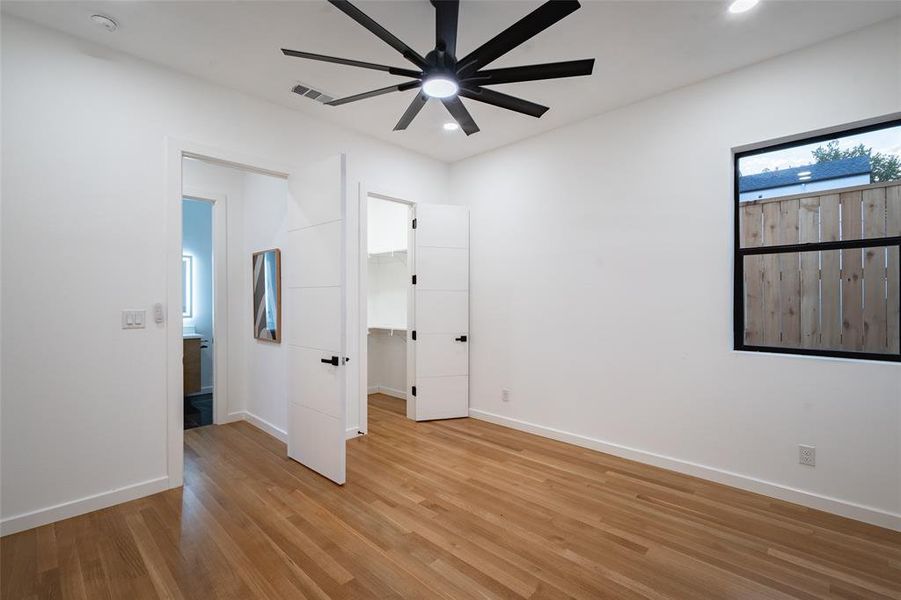 Unfurnished bedroom featuring light hardwood / wood-style floors and ceiling fan