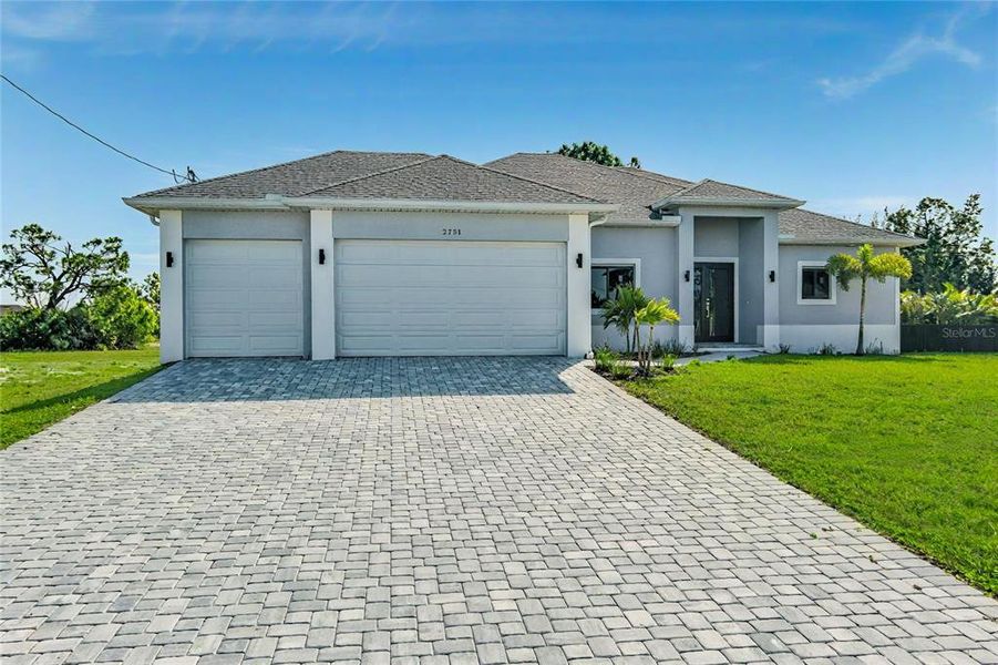 Front exterior of a new home in , Cape Coral, FL, highlighting curb appeal (Image 24). Front exterior of a new home in , Cape Coral, FL, highlighting curb appeal (Image 24).