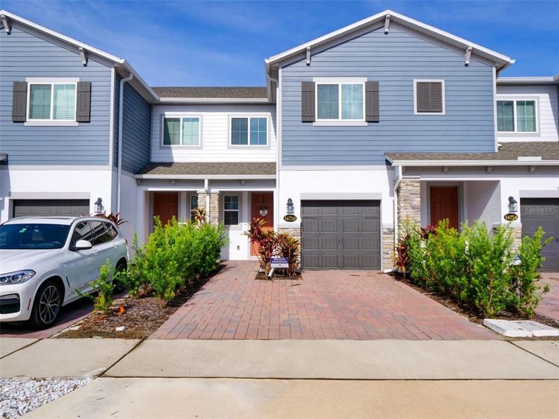 Front exterior of a new home in , Orlando, FL, highlighting curb appeal (Image 20).