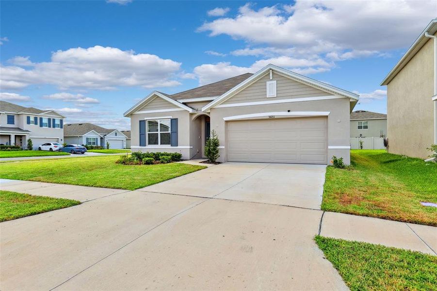Front exterior of a new home in , Wesley Chapel, FL, highlighting curb appeal (Image 22).
