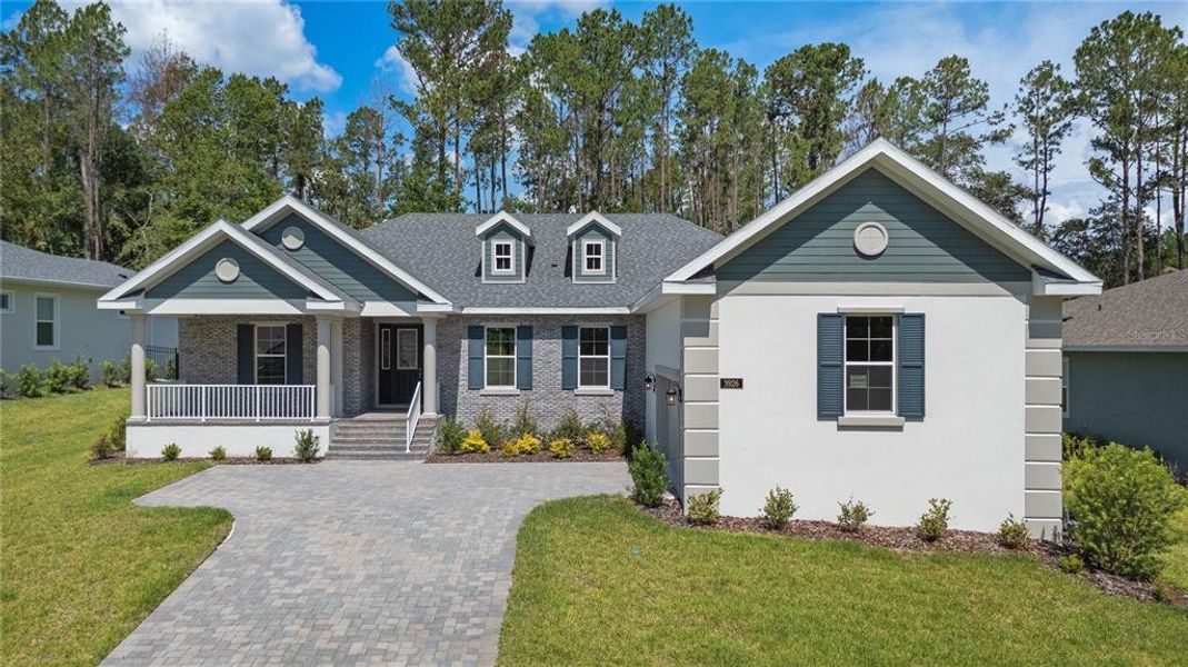 Front exterior of a new home in Southern Hills Plantation, Brooksville, FL, highlighting curb appeal (Image 23). Front exterior of a new home in Southern Hills Plantation, Brooksville, FL, highlighting curb appeal (Image 23).