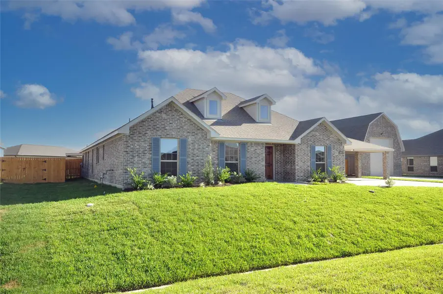 Front exterior of a new home in Pedregal, League City, TX, highlighting curb appeal (Image 23).