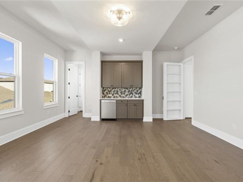 Spacious, unfurnished interior of a new home in The Village at Towne Lake, Woodstock (Image 46).