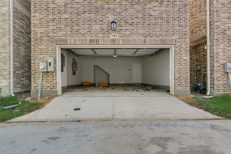 Garage featuring a carport