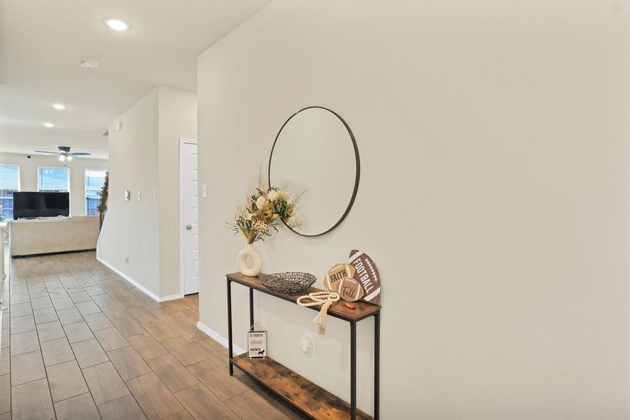 Corridor with hardwood / wood-style flooring