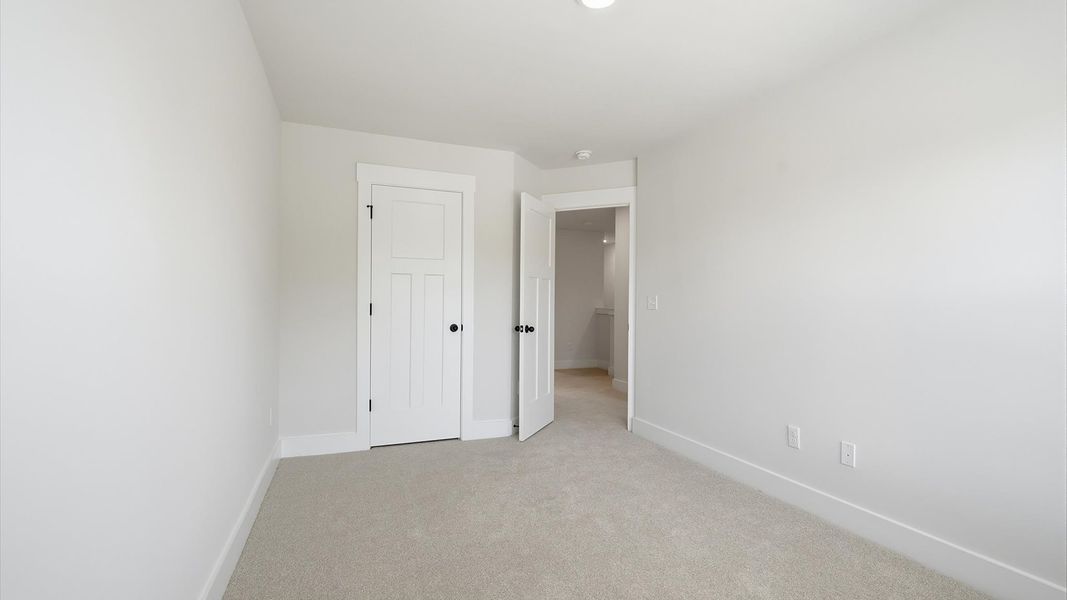 First-rate secondary bedroom with a spacious walk-in closet and elegant carpeted flooring in Greenville, SC First-rate secondary bedroom with a spacious walk-in closet and elegant carpeted flooring in Greenville, SC