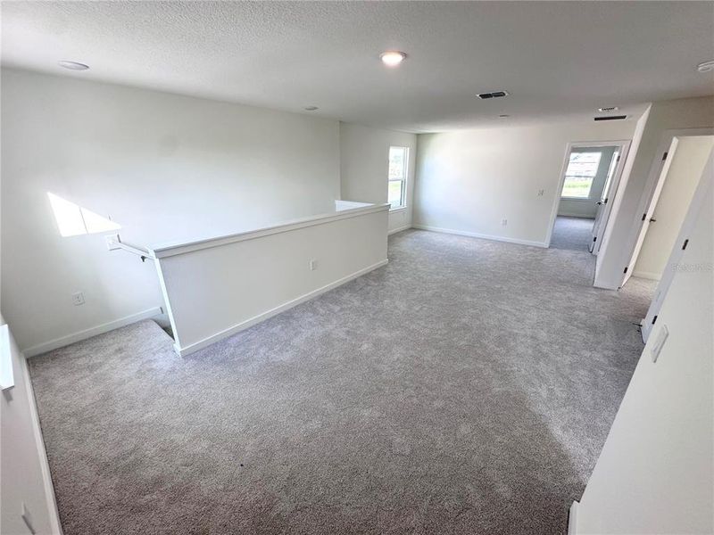 Spacious, unfurnished interior of a new home in Grasslands West, Lakeland (Image 27).