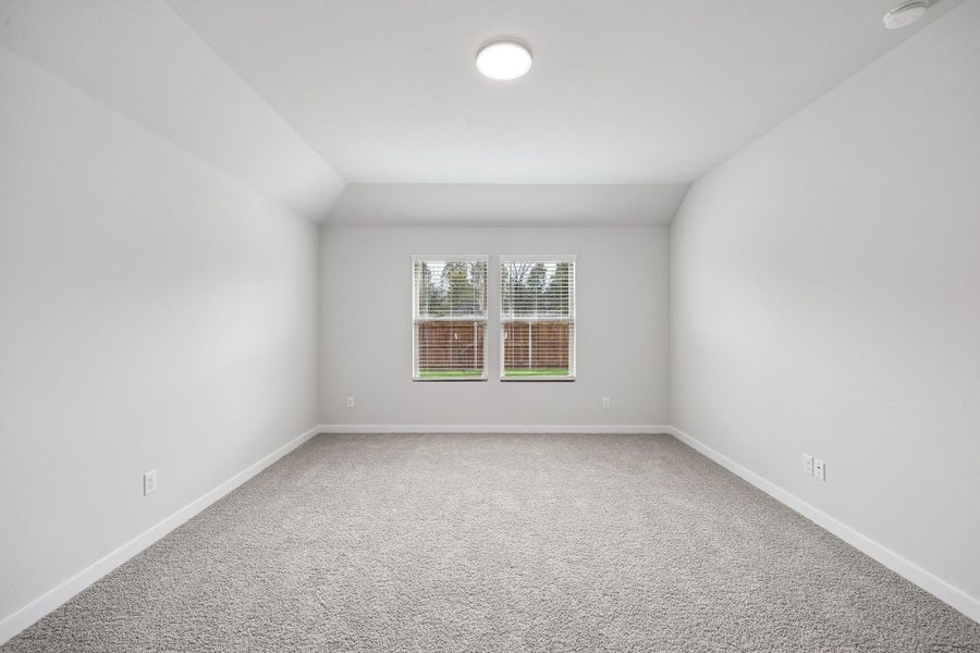 Primary Suite in the Heisman home plan by Trophy Signature Homes – REPRESENTATIVE PHOTO