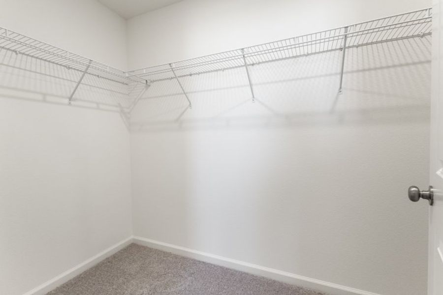 A white wall with a metal railing. A white wall with a metal railing.