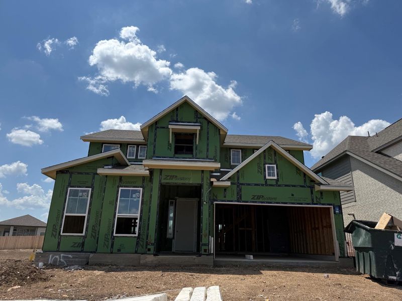 A new two-story residence takes shape under a bright blue sky. A new two-story residence takes shape under a bright blue sky.