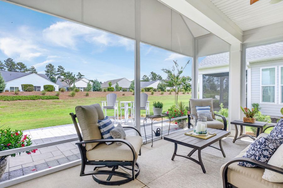 Exterior details and patio area of a home in K. Hovnanian's® Four Seasons at Lakes of Cane Bay, Summerville (Image 30).