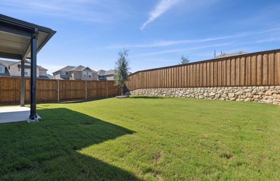 Exterior details and patio area of a home in Spiritas Ranch, Little Elm (Image 2).