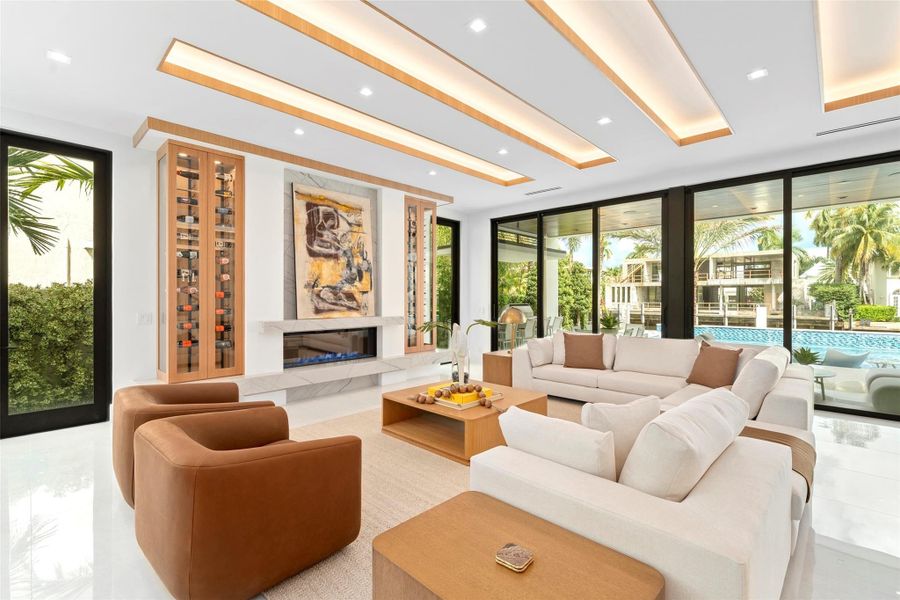 Rich finishes, custom millwork, and refined architectural details create a timeless ambiance. Just minutes from the ocean and downtown Las Olas,