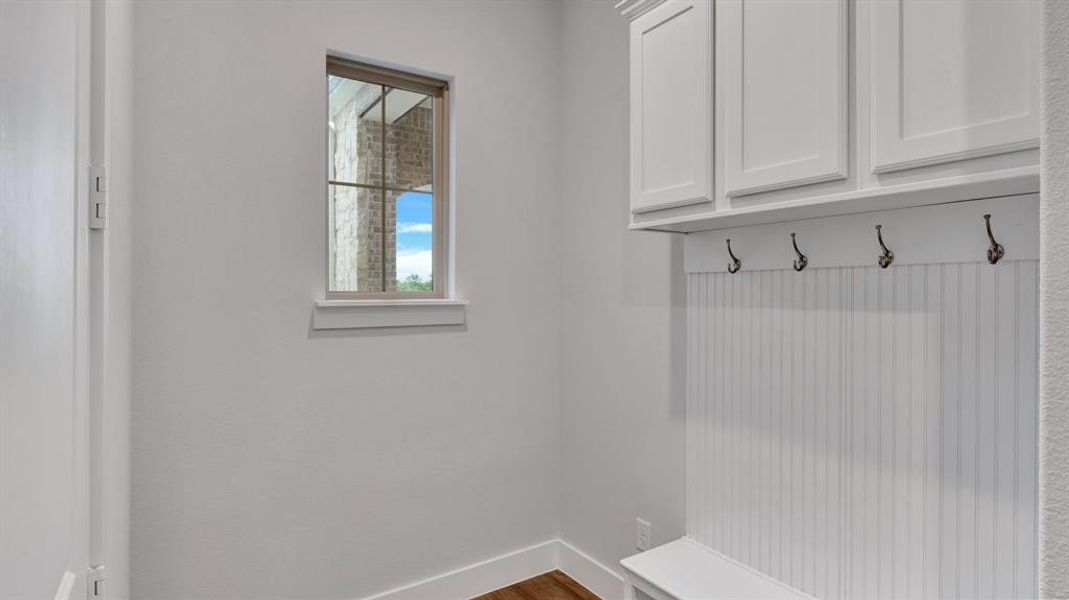 Mudroom with hardwood / wood-style flooring