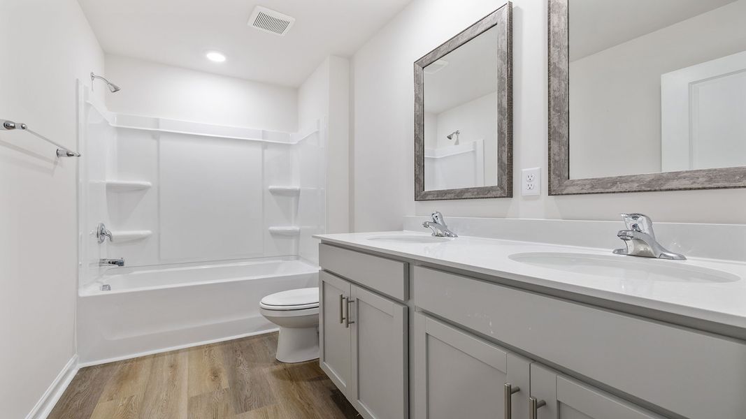 Furnished interior view inside a new home in Bentley Park, Greenwood (Image 10).