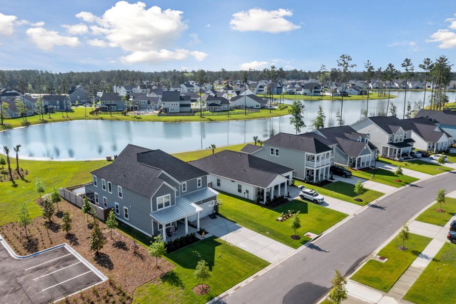 Front exterior of a new home in Waterside at Lakes of Cane Bay: Coastal Collection, Summerville, SC, highlighting curb appeal (Image 17).